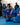 Blue Gracie Barra kimono and gi pants with red Barra Shield shoulder patch and Gracie Barra lapel patch, worn in class on a blue mat