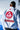 White 40 Year Anniversary Kimono, back view; red circular Gracie Barra Red Shield back patch, gold-bordered red EQUIPE GB patch, 40 Years collar tag, black belt.