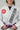 Close-up of the adidas Pro Lite Comp Kimono in white with Gracie Barra branding on the chest and lapel, showcasing fabric texture and embroidery detail.