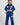 Child wearing a blue Pro Lite Comp Youth Kimono by adidas with Gracie Barra patches, standing against a plain background