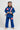 Child wearing a blue Pro Lite Comp Youth Kimono by adidas with Gracie Barra patches, standing against a plain background