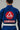 Close-up of back of men's blue Pro Lite Comp Kimono by adidas showing red Gracie Barra and EQUIPE GB patches