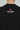 Back detail of the Black Red Shield Elite Mens Tee, showing the red Legacy G mark above the white “Jiu-Jitsu Brasileiro” print against a light gray background.