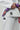 Detail of white Pro Lite Comp Kimono by adidas, highlighting the hip area with adidas and Gracie Barra logos visible on the pants and jacket against a plain background.