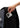 Hand placing smartphone into exterior quick-access pocket of Arte Suave V3 backpack, demonstrating convenient storage access