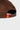 Back detail of the brown Arte Suave cap showing the adjustable snapback strap and orange tab with the yellow Legacy G logo.