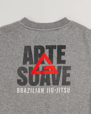 Close-up of back graphic on grey Arte Suave V2 kids crewneck sweatshirt by Gracie Barra, featuring “Arte Suave” text with integrated flow pattern, red Legacy G and “Brazilian Jiu-Jitsu” text in white.
