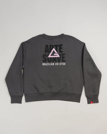 Back view of dark grey Arte Suave V2 women’s crewneck sweatshirt by Gracie Barra, featuring large “Arte Suave” graphic with integrated flow pattern, pink Legacy G logo, and “Brazilian Jiu-Jitsu” text in white.