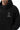 Arte Suave V3 Mens Hoodie in black, torso close-up of the chest print: silver Legacy G logo above white 'Arte Suave' script, beside the hood.