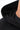 Arte Suave V3 Mens Hoodie in black, close-up of the hood and neckline, with a crew-neck tee layered underneath.