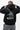 Arte Suave V3 Mens Hoodie in black, back view. Full-back print: white 'Arte Suave' script, gray tonal figure, white 'Gracie Barra' wordmark.