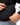 Arte Suave V3 Mens Hoodie in black, close-up of the hidden side-zip pocket being unzipped, with ribbed hem.