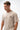Arte Suave V3 Mens Tee in natural, three-quarter front view showing the boxy fit and the small Legacy G and 'Arte Suave' chest print.