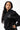 Arte Suave V3 Womens Hoodie in black, three-quarter front on model. Relaxed oversized fit, silver Legacy G logo and white 'Arte Suave' chest script.