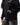 Arte Suave V3 Womens Hoodie in black, torso close-up with hand in the kangaroo pocket: silver Legacy G logo, white 'Arte Suave' script, ribbed cuff.