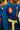 Close-up of the blue AtletaGB V5 CompLite kids kimono with red Barra Shield chest patch, Gracie Barra lapel patch, GB tab and tonal Competition skirt embroidery