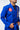 Shoulder and chest of the blue AtletaGB V5 CompLite Kimono with the red Barra Shield patch and pearl-weave cotton jacket.