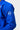 White GB circle embroidery on the sleeve of the blue AtletaGB V5 CompLite Kimono pearl-weave jacket.