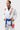 Three-quarter front view of the white AtletaGB V5 CompLite Kimono showing the Barra Shield and red-bordered Gracie Barra lapel patch.
