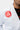 Red Barra Shield patch on the shoulder of the white AtletaGB V5 CompLite Kimono beside the reinforced collar.