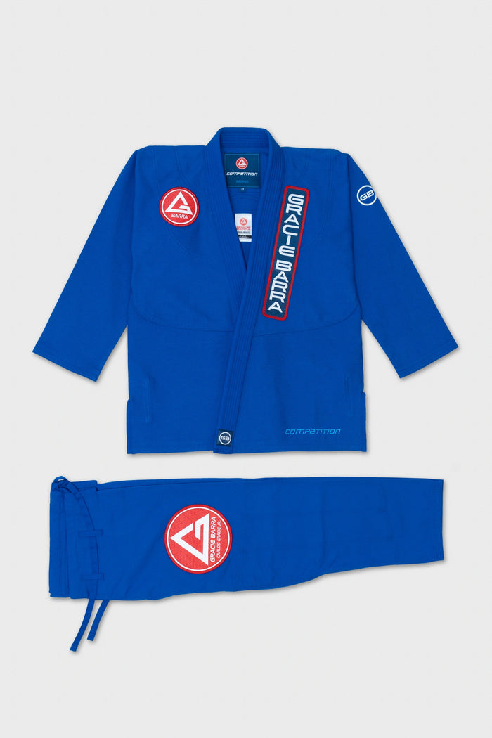 Womens AtletaGB V5 CompLite Kimono in blue, jacket and pants laid flat with red Barra shield, Gracie Barra lapel patch and GB sleeve patch.