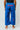 Young athlete wearing blue Atleta Kids Competition Kimono Pants with red Gracie Barra print, back view