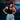Black Gracie Barra Balance Sports Bra worn on the mats, front view with the rubberized white Legacy G logo centered on the chest.