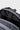 Open top of the black Barra Beachwalk Backpack showing a laptop in the interior sleeve behind the black grab handle.