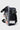 Side of the black Barra Beachwalk lunchbox showing the clear zip pocket, red Gracie Barra rubber patch, writable name label, and shoulder strap clip.