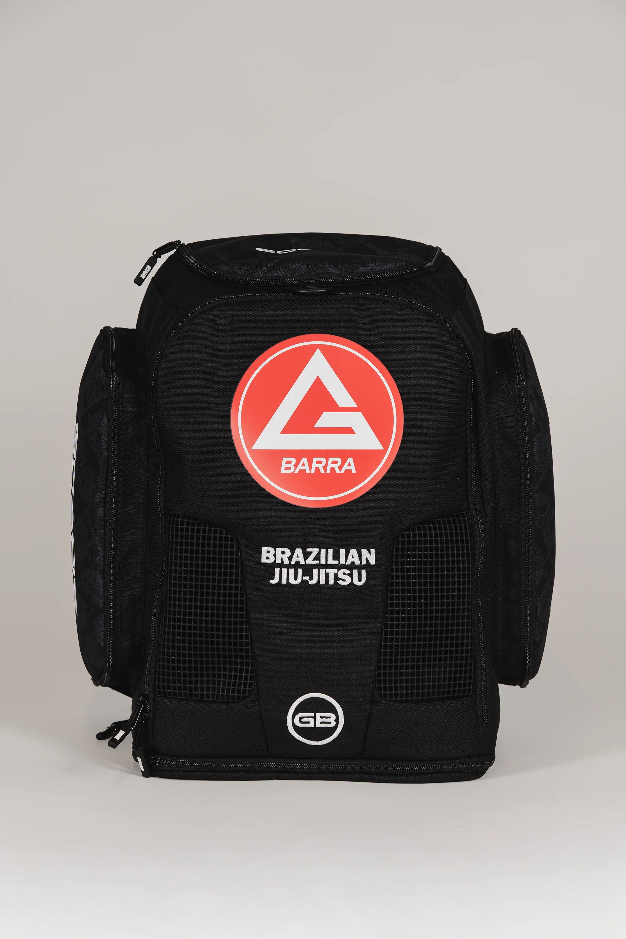 Front view of Black Barra da Tijuca Backpack featuring the red Barra shield logo and “Brazilian Jiu-Jitsu” text, designed for versatile everyday and training use.