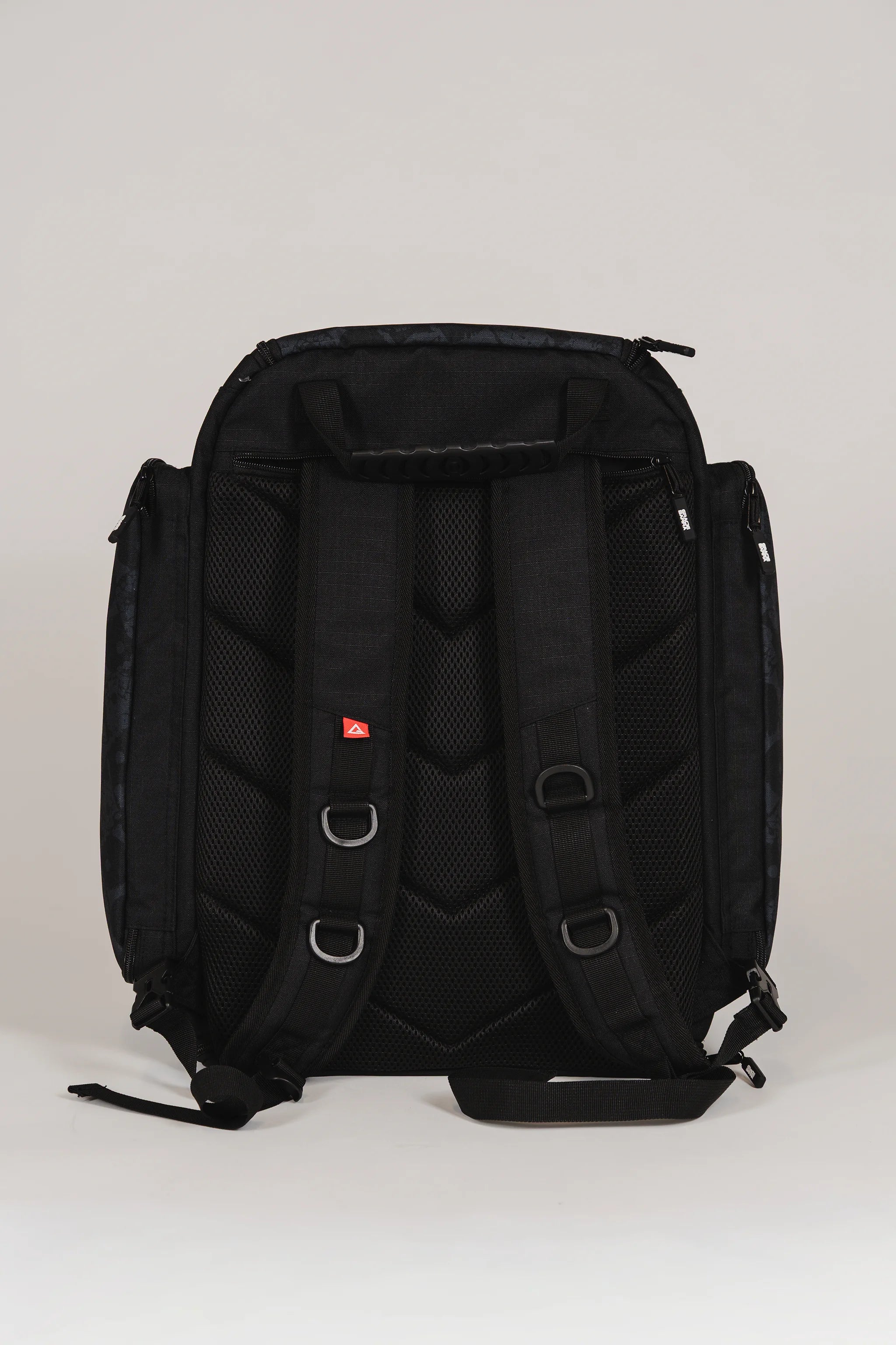 Back view of Black Barra da Tijuca Backpack showing padded shoulder straps, mesh ventilation panels, and reinforced stitching for ergonomic comfort and durability.