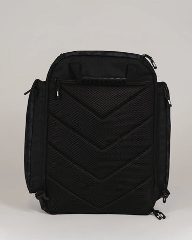 Back view of Black Barra da Tijuca Backpack with shoulder straps tucked in, showing padded mesh back panel and duffel carry configuration option.