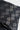 Close-up of the gray Barra Da Tijuca boardwalk pattern printed on the black stretch fabric of the Gracie Barra Hybrid Shorts
