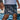 White Gracie Barra wordmark on the left leg of the black Barra da Tijuca Hybrid Shorts with gray geometric boardwalk pattern