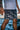 White Gracie Barra wordmark on the left leg of the black Barra da Tijuca Hybrid Shorts with gray geometric boardwalk pattern