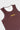 Close-up of the yellow stacked Gracie Barra chest logo on the maroon Barra Da Tijuca Terra Mar tank, with white mesh neckline lining