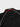 Close-up of the white ESTD 1986 embroidery and red trim stripe on the back collar of the black Barra Origins jersey.