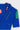 Collar and shoulder detail of the blue Brasileiro Youth Kimono jacket. Tonal vertical Gracie Barra patch, green three-stripe shoulder, yellow "JIU-JITSU" embroidery, and adidas and Barra collar labels.