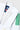 Collar and shoulder detail of the white Brasileiro Youth Kimono jacket. Tonal vertical Gracie Barra patch, green three-stripe shoulder, and adidas and Barra collar labels with Y3 size tag.