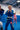 Brasileiro Youth Kimono by adidas in blue worn in class, showing green shoulder stripes, a Brazil flag patch, and the red Barra Shield on the pants.