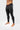 Side view of the black Gracie Barra Close Contact Compression Pants showing the gray striped side panel with the white stacked Gracie Barra logo.