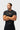 Front torso view of the black Gracie Barra Close Contact Rashguard, showing the chest print and the compression fit through the body.
