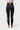 Full back view of the black Close Contact Womens Compression Pants with the red center back tab, gray striped panels and Barra Shield on the calf.