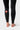 Back lower leg detail of the black Close Contact Womens Compression Pants showing the red Barra Shield on the calf and the ankle hem.