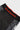 Close-up of the red GRACIE BARRA waistband print and red interior trim on the black Close Contact womens compression pants.