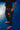 Full-length view of the black Close Contact womens compression pants worn barefoot on a blue mat, showing waist-to-ankle coverage.