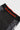 Detail of the waist seam and gray striped side panel on the black Close Contact womens compression pants.