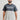 Professor wearing the gray and black Gracie Barra Colorblock Mens Tee, front view with the Stacked chest logo and red cuff stitching