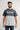Professor wearing the gray and black Gracie Barra Colorblock Mens Tee, front view with the Stacked chest logo and red cuff stitching