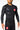 Black Continuum longsleeve rashguard worn at a three-quarter angle, tonal green Vanguard print down the left sleeve and yellow Equipe shoulder print